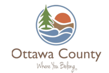 Ottawa County seal with pine, sun, and river and the tagline Where You Belong